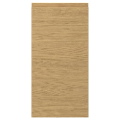 A VOXTORP door front. It is rectangular, in an oak colour, with a smooth finish and integrated handles.