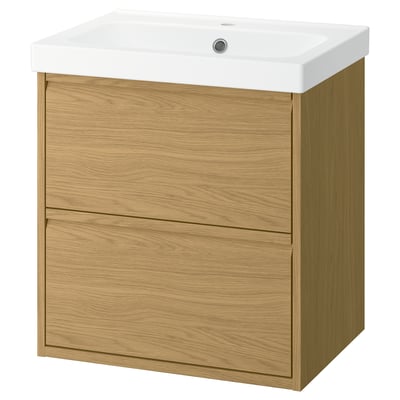 ÄNGSJÖN light oak bathroom cabinet with two drawers and a white ceramic sink.