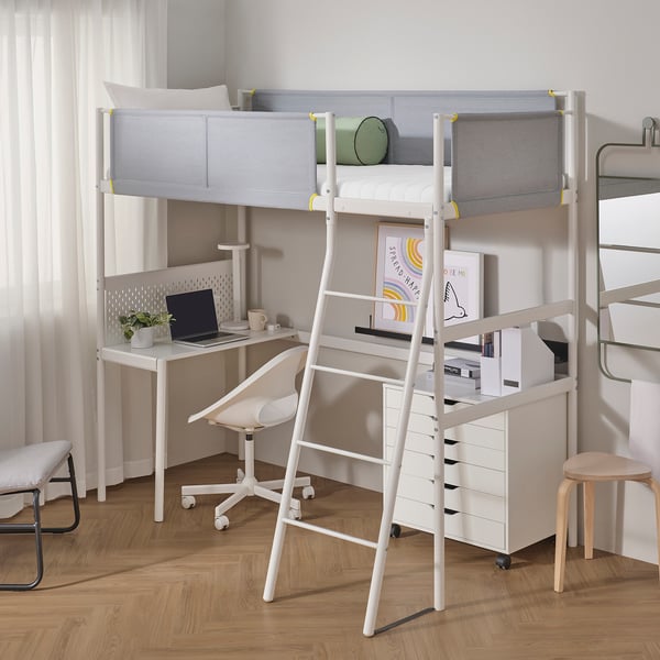 Modern white bunk bed with metal ladder, built-in desk, and storage shelves. Larger than nearby stools and curtained window.