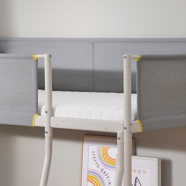 Bunk bed with firm, supportive mattress. Railings ensure safety on upper bunk.