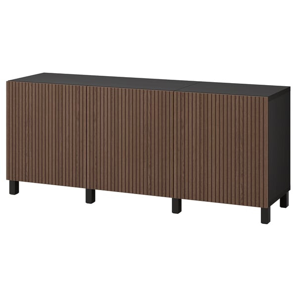 Modern BESTÅ sideboard, dark brown and black, rectangular with wooden slats and square legs.