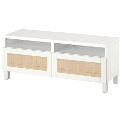 White tv console with woven panels, two open shelves, and two drawers for cable management and storage.