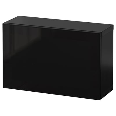 A black BESTÅ storage unit. Its rectangular, with a glossy finish. The unit is a single cabinet, simple and modern in design.