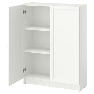 A white BILLY bookcase with two open doors, revealing adjustable shelves inside. Its simple, square design offers versatile storage.