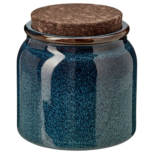 Round blue-glazed stoneware jar with cork lid, stylish for storage or display.