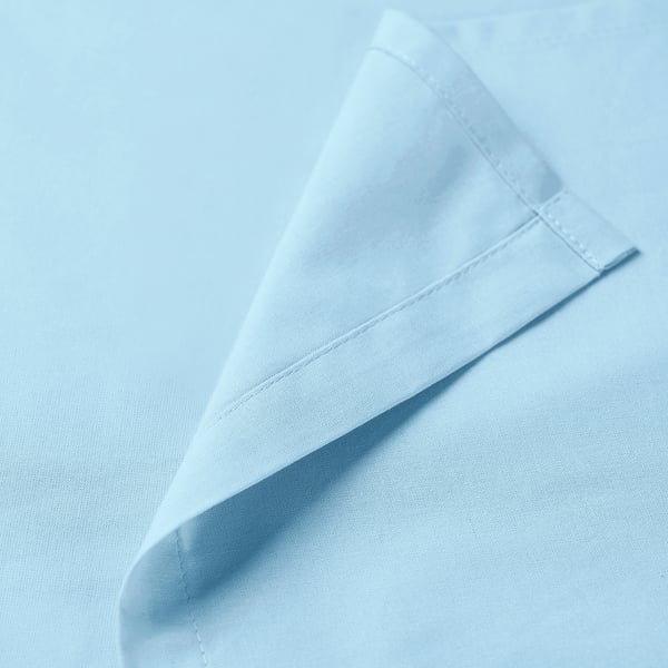 Soft, light blue cotton flat sheet folded neatly, showcasing smooth texture and quality stitching.