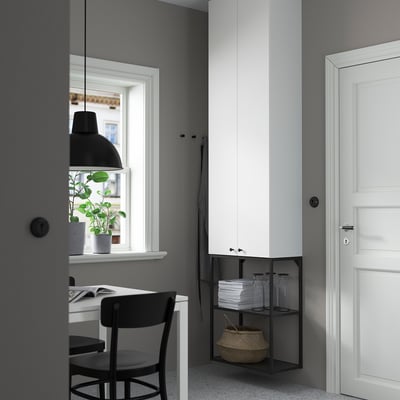 Modern ENHET storage in home office, white cabinet, black chair, desk, jars, basket, large window.