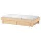 Natural wood extendable bed with white mattress, ideal for space-saving and versatile use.
