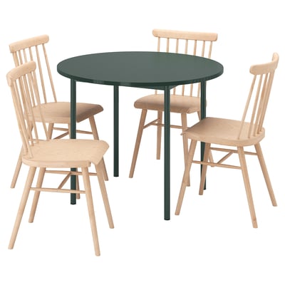 IKEA PS 2026 dining set: round green table, four light wood chairs with spindles, modern classic design.