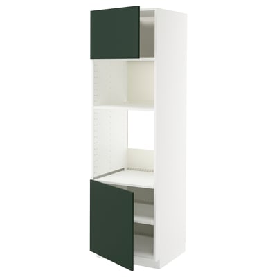 Depicts a white METOD kitchen unit with deep green doors open, showing internal shelves.