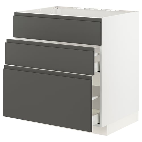 Modern white kitchen unit with grey drawers, sturdy and sleek design, ideal for storage.