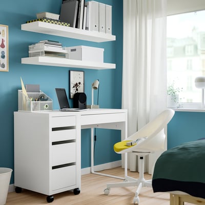 A white MICKE mobile filing cabinet with four drawers on wheels.