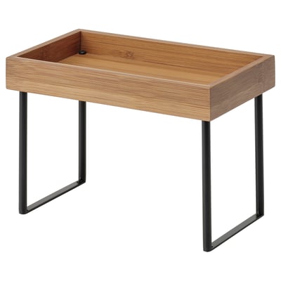 A wooden tray with black metal legs called NÅLBLECKA, perfect for organising kitchen items.