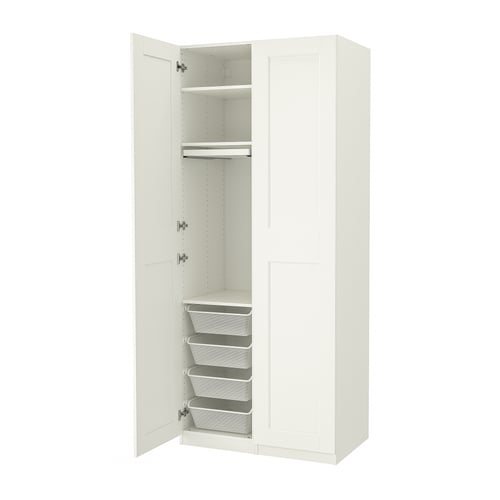 An open white PAX wardrobe with shelves and mesh baskets inside.