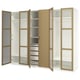 Open white and oak wardrobe with glass, shelves, and drawers.
