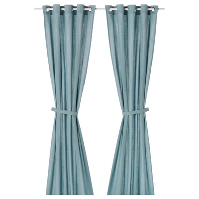 Two RITVA curtains in grey-blue, made of 100% cotton with a linen-like texture, featuring eyelets, tied back, hanging straight.
