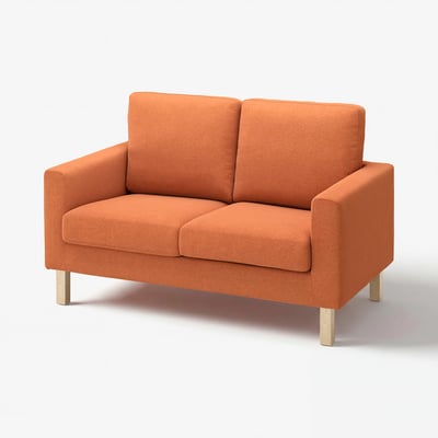 An orange SALTSJÖBADEN loveseat. It has a soft fabric cover, wooden legs, and a simple, clean design.