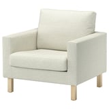 Grey SALTSJÖBADEN armchair with wooden legs, modern & cushioned.