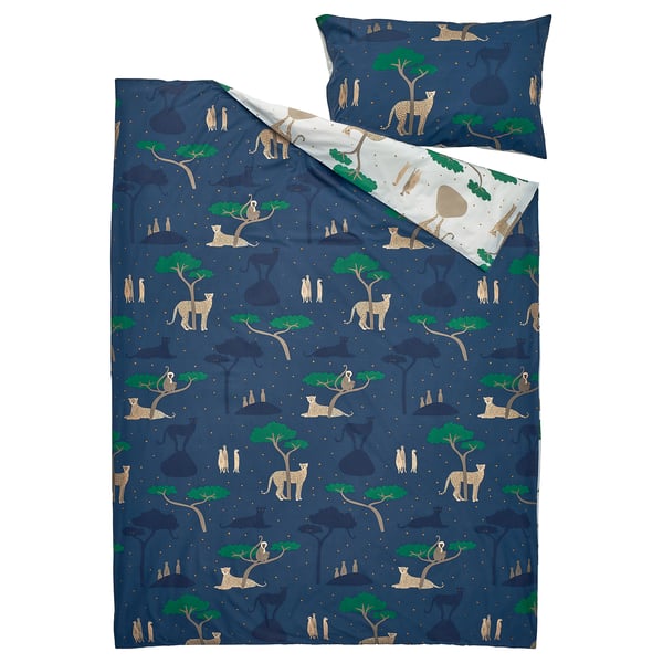 A blue SANDLÖPARE duvet cover set with cheetahs and trees in a savannah design, made from a blend of cotton and viscose.