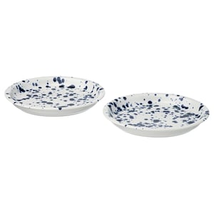 Two white plates with blue speckles, round shape, easy-grip edges, made of stoneware.