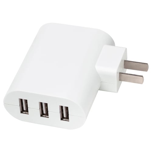 White triple-port usb charger. Three usb-a slots for charging multiple devices simultaneously, compact design for travel.