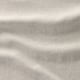 Textured beige upholstery close-up, showcasing soft, woven fabric quality.