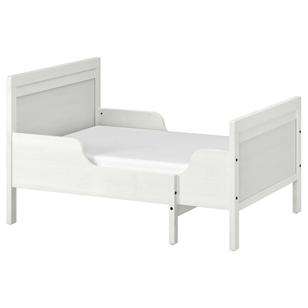 A white SUNDVIK toddler bed with extendable made from solid pine and fiberboard, designed for durability and timeless style.