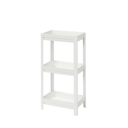 A white VESKEN three-shelf organising unit made of polypropylene plastic. The shelves are rectangular with high edges to prevent items from falling.