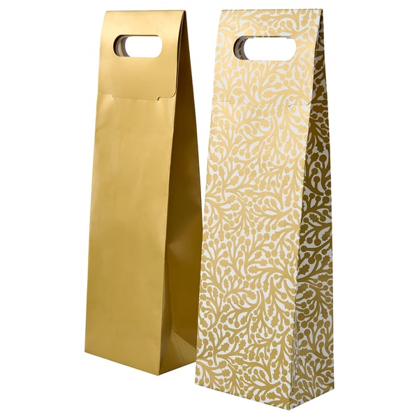 Two gold-colored gift bags; one plain, one patterned with white designs, both upright with handles.