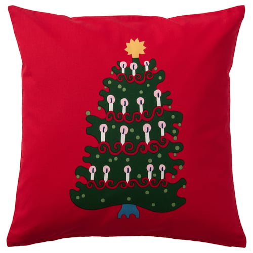 Square red pillow with green christmas tree and candles design.