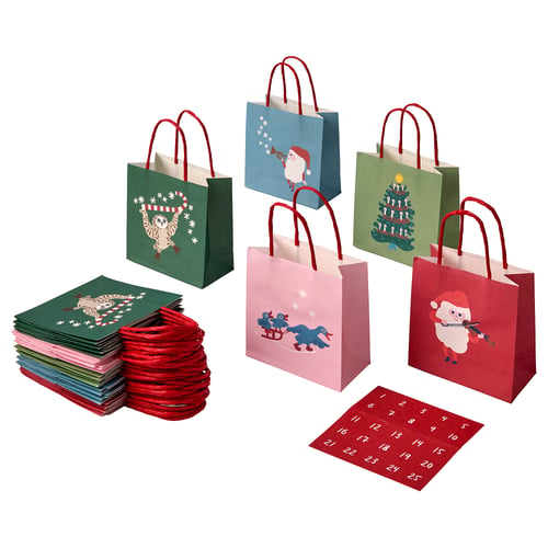 A set of colourful christmas gift bags, featuring holiday designs like santa and a sleigh, made of paper.