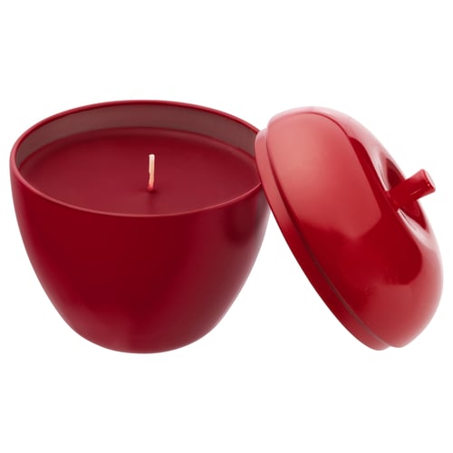 Bright red apple-shaped candle in shiny container with matching lid, designed for storing small items when not in use.