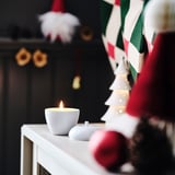 VINTERFINT Scented candle in metal cup, apple-shaped/Vanilla white, 24 hr