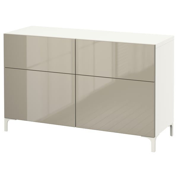 Modern white and beige cabinet with four sections: two drawers and two shelves, supported by sleek white legs, designed for stylish storage.