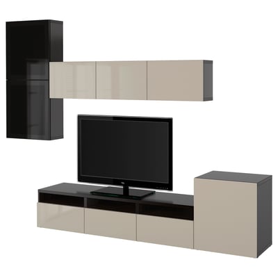 Modern black and beige tv unit with wall and floor cabinets, centralizing a flat screen tv.