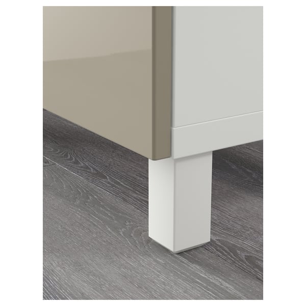Modern, high-quality furniture piece part. Clean lines, white and beige finish, sturdy legs.