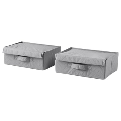 Two light gray fabric storage boxes with handles, rectangular and lid-covered, likely for organizing items.