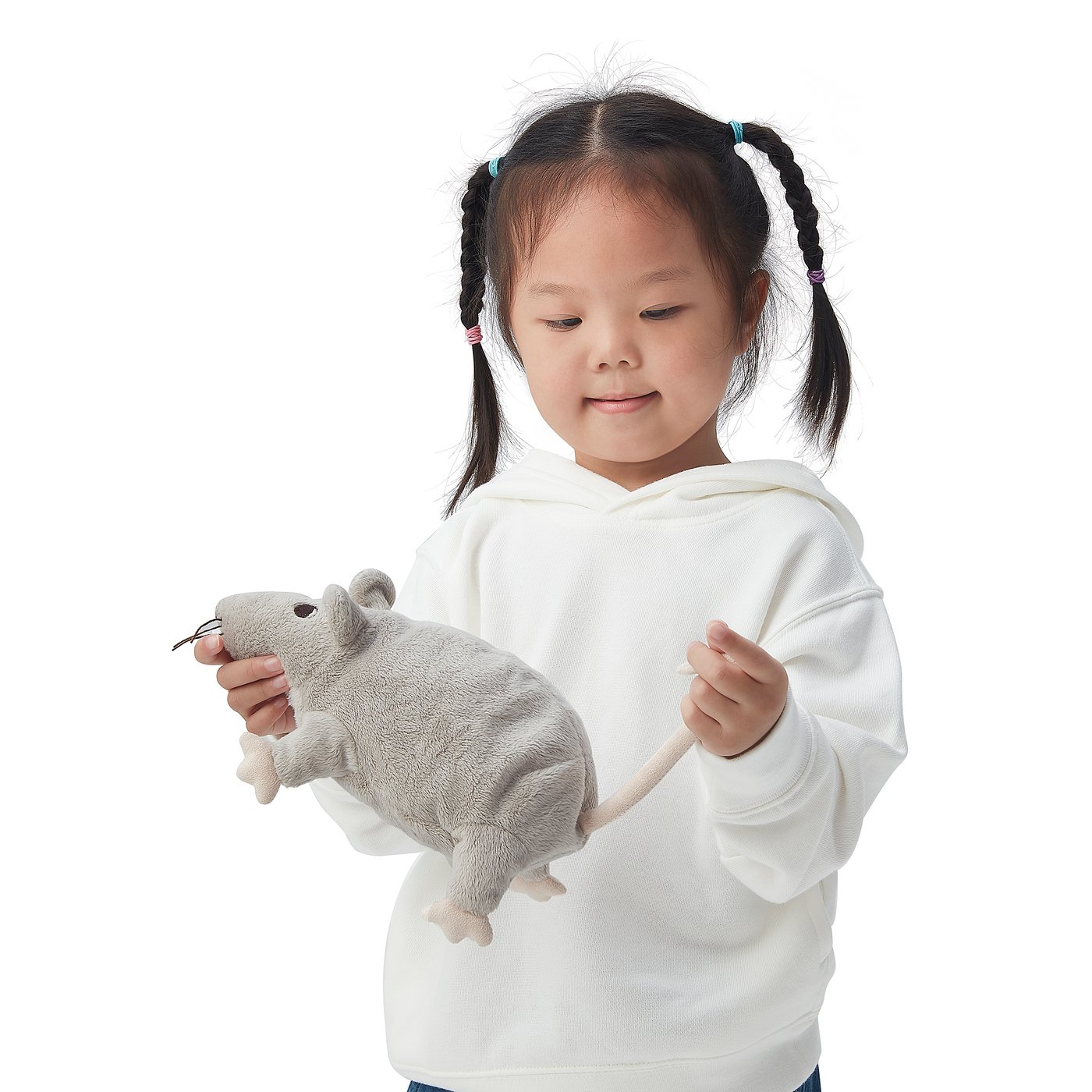 Child holding gray GOSIG RÅTTA plush toy in white hoodie.