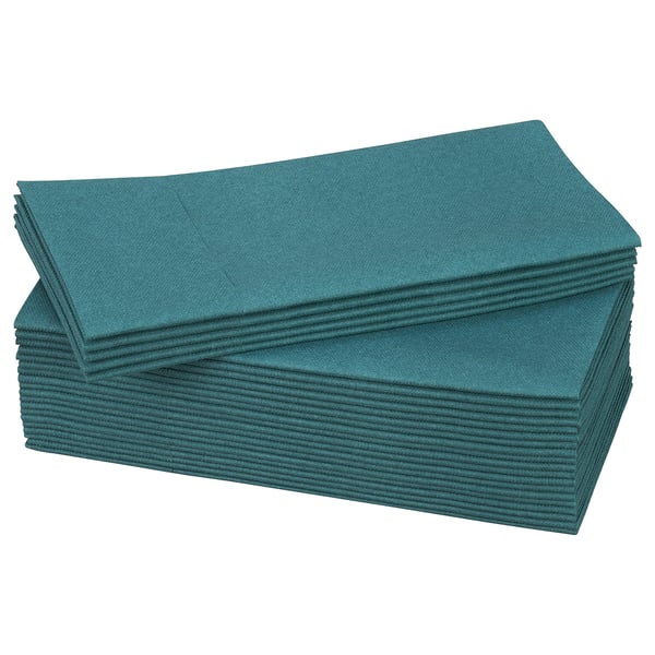 Stacked green paper napkins, neatly folded, rectangular shape.