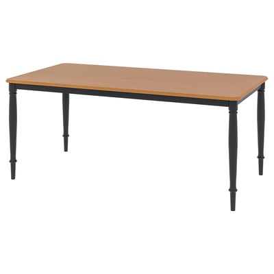 DANDERYD rectangular dining table, light brown top, black metal legs, sturdy design.