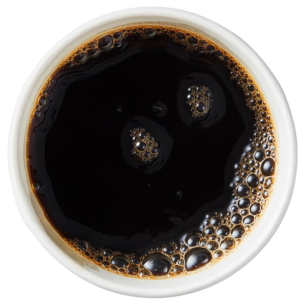 Cup of black coffee with foam.