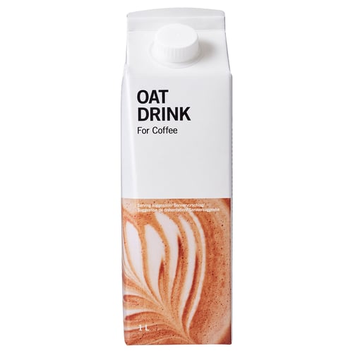 Karton mit Haferdrink zum Kaffee. Weiß mit Kappe, Etikett zeigt schaumigen Haferdrink.