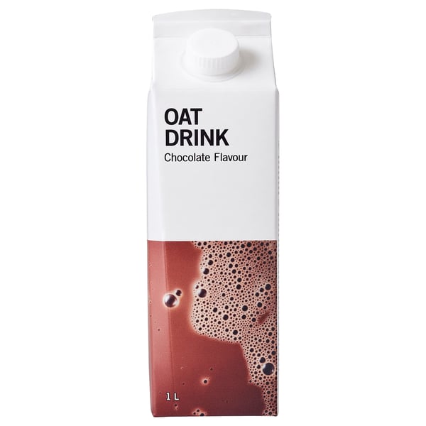 Carton of chocolate oat drink. White cap on top, brown liquid visible through clear section.