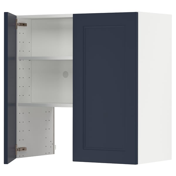 A blue METOD kitchen cabinet with an open door revealing adjustable shelves. Its rectangular with steel hinges.