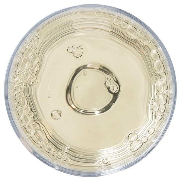 Clear glass plate with intricate bubble patterns on the edge. Ideal for serving meals.
