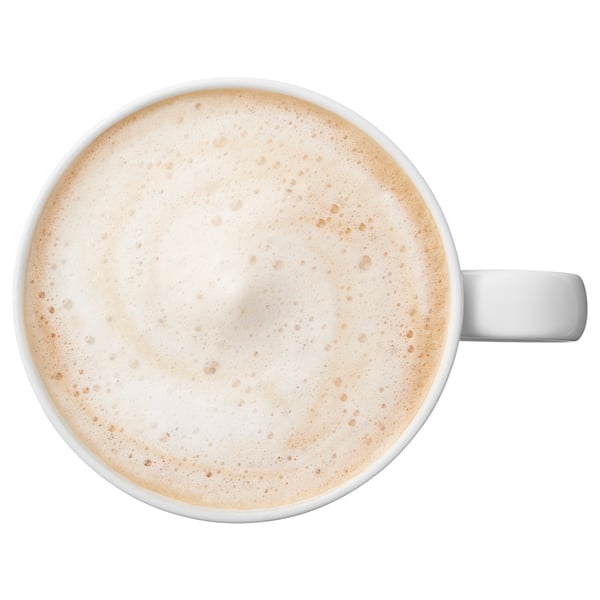 Top view of a cup of frothy coffee in a white mug.