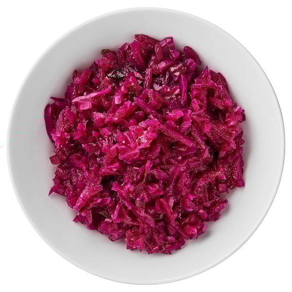 A bowl filled with chopped, vibrant red cabbage.