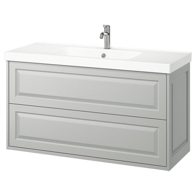 TÄNNFORSEN vanity in light grey with beveled edges. Modern, wall-mounted design with two spacious drawers. White ceramic sink and chrome faucet.