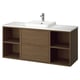 The ÄNGSJÖN bathroom cabinet in brown oak. It a semi-recessed white marble sink atop open and closed storage.