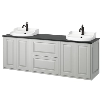 A TÄNNFORSEN white vanity with two sinks and cabinets. Its a modern bathroom piece with light grey, beveled panels, offering ample storage.